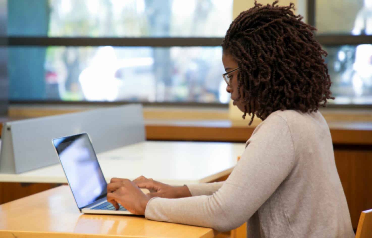 Financial analyst working with valuation models and spreadsheets